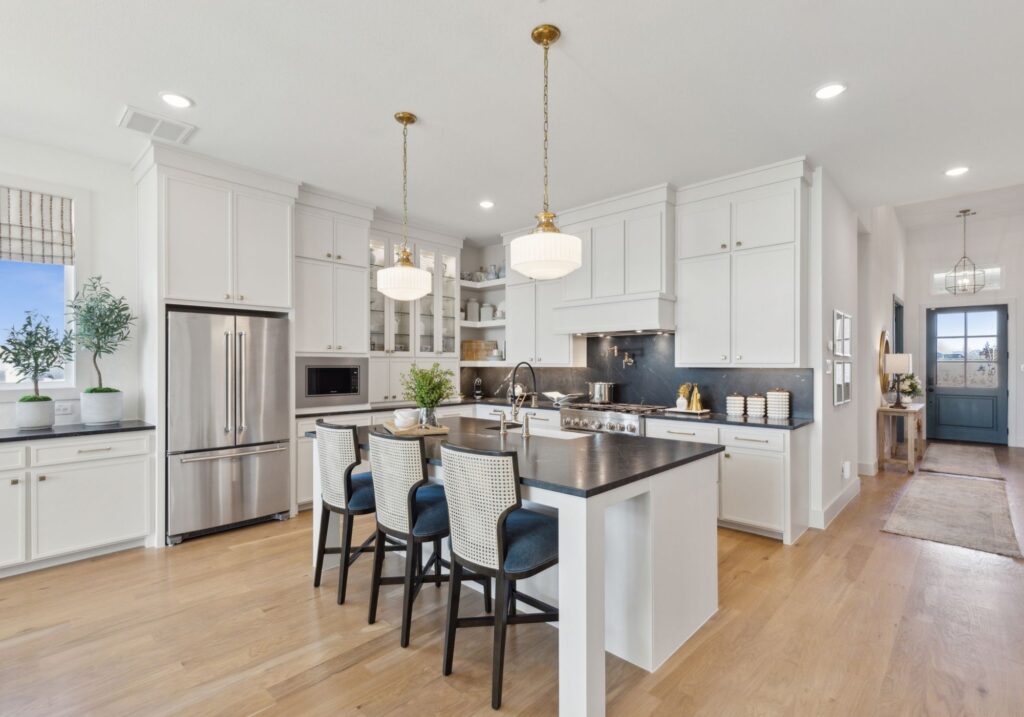 Kitchen view with island in the Lakewood III Floorplan at Painted Tree 50' Series.