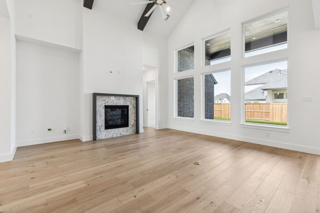 Family Room in 4220 Kinglet Court at Windsong Ranch 61' Series in Prosper, TX.