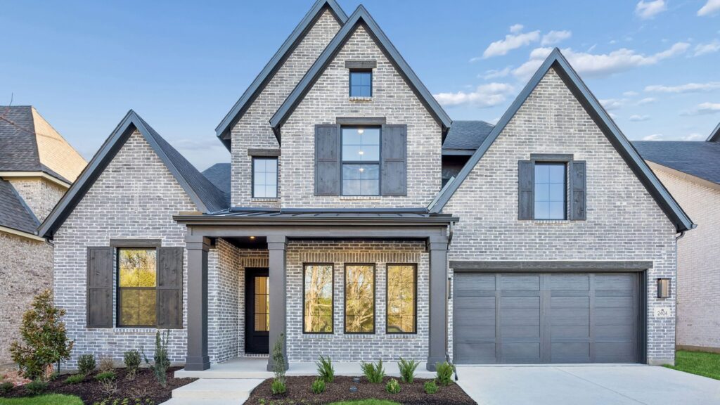 Exterior of the Madison II floorplan at Painted Tree 60s in McKinney, TX.
