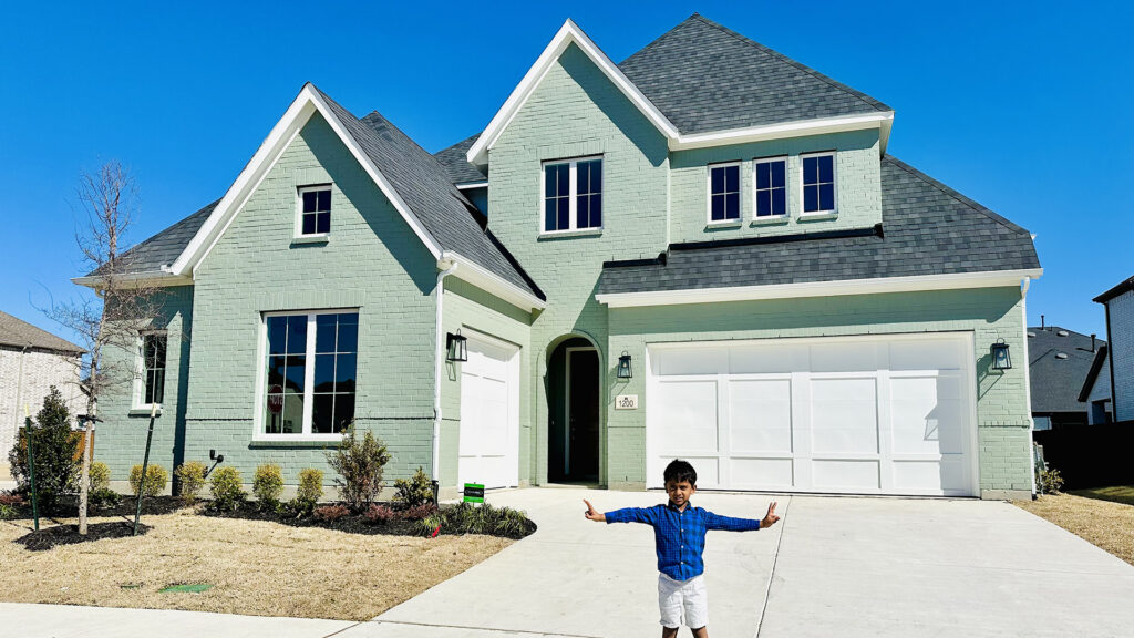 Homeowner's kid in front of his Windsong Ranch house.