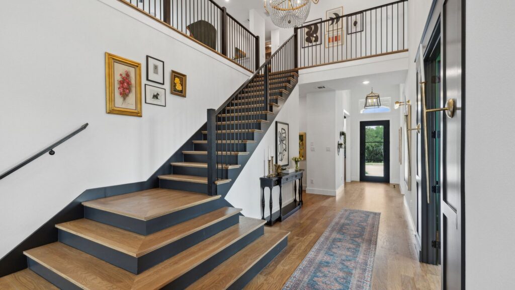 Staircase in the Windsong Ranch Hudson II model home in Prosper, TX.
